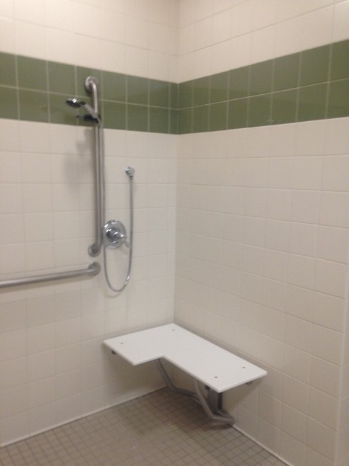 Showers are outfitted to be either used with built in seat or personal shower chair.